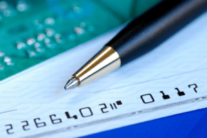 Checkbook, debit card, and pen